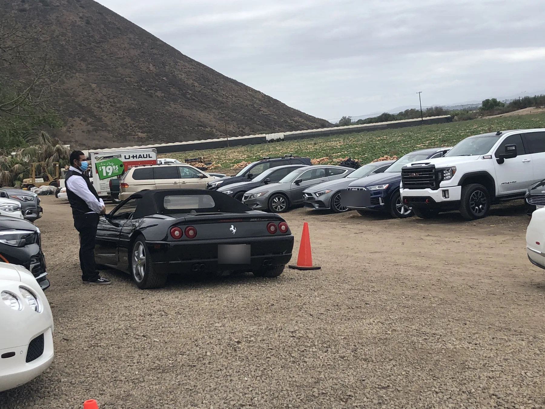 A&A Parking Services attendant supervising a full managed parking lot at an outdoor event