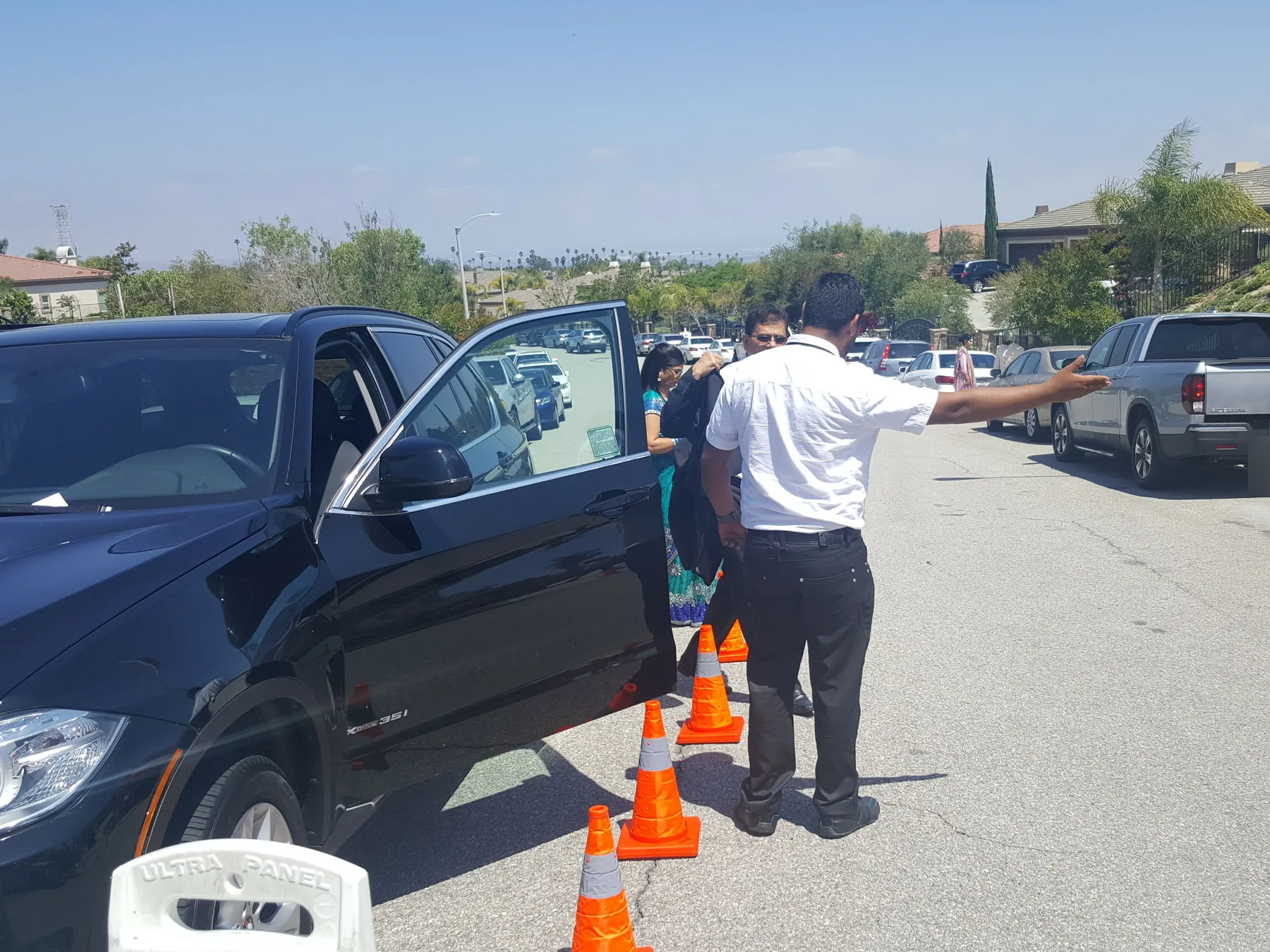 A&A Parking Services attendant directing traffic with cones at a residential event