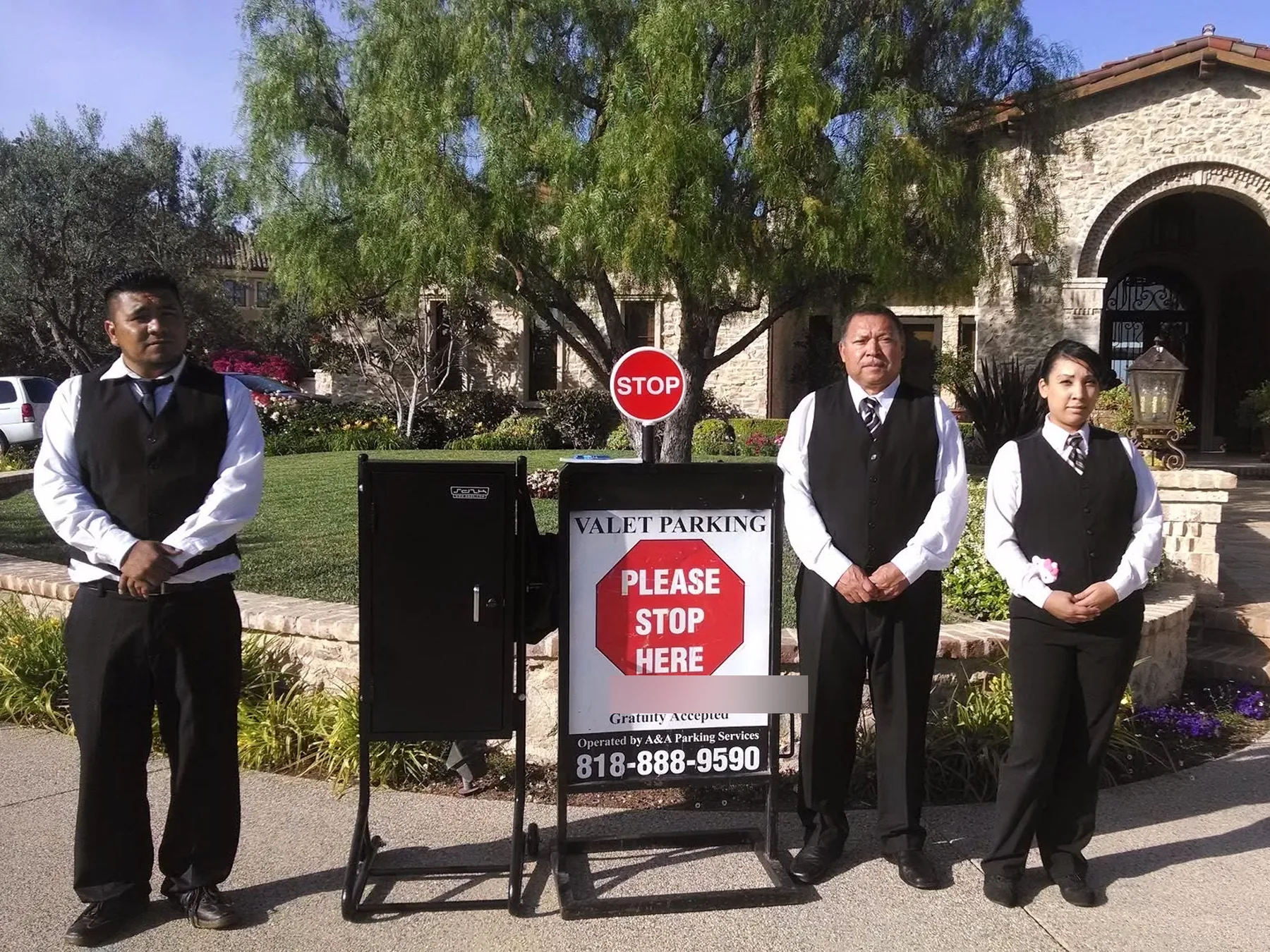 A&A Parking Services valet crew beside the company VALET PARKING sign at a private estate in Los Angeles County