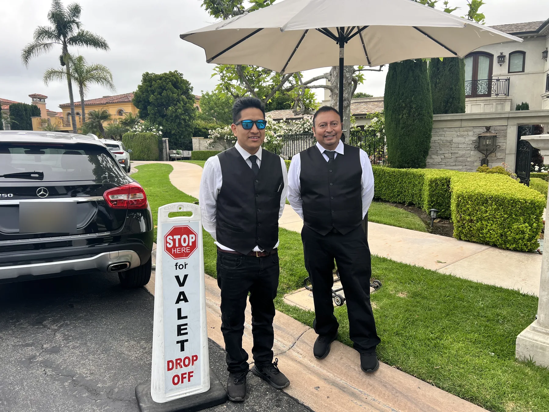 A&A Parking Services attendants at a private estate driveway drop-off