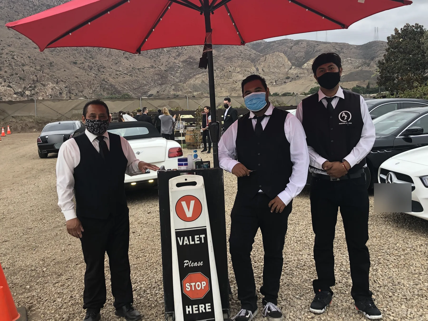 A&A Parking Services valet team at the VALET sign at an outdoor wedding venue