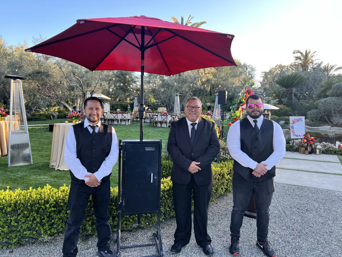 A&A Parking Services valet attendants at a valet podium during a private party at a Beverly Hills luxury home
